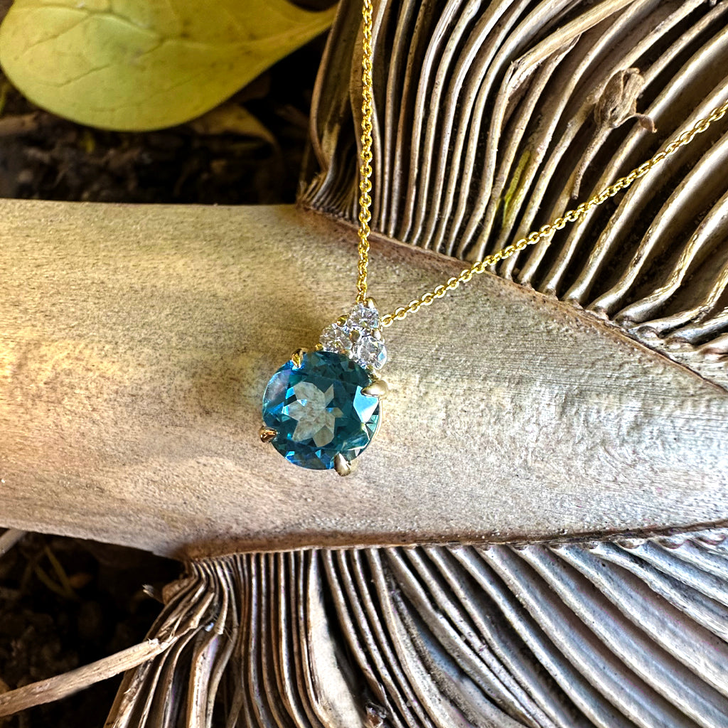 Gorgeous Blue Topaz With Trilogy Diamond Highlight Yellow Gold Pendant And Chain