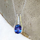 Split White Gold Oval Tanzanite Pendant with Diamond Stripe Highlight