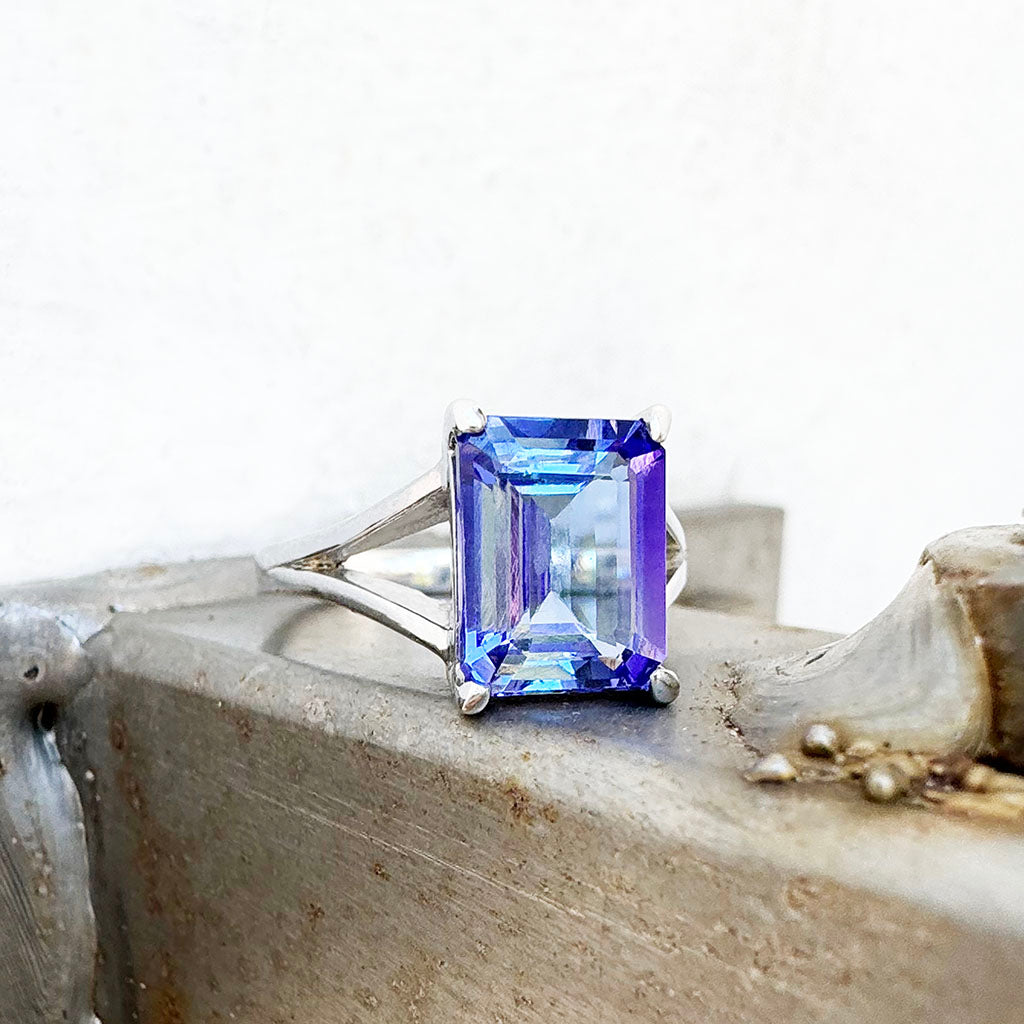 Regal Elevated Emerald Cut Tanzanite Solitaire White Gold Ring