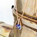 Split Rose Gold Round Tanzanite Pendant with Diamond Stripe Highlight