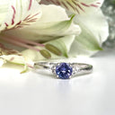 Silver Petite Round Cut Tanzanite with Trilogy Diamond Highlight Ring