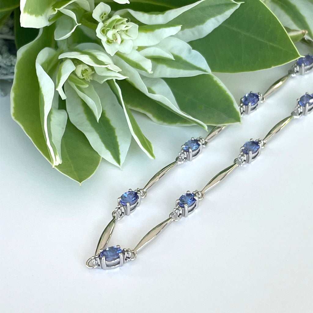 Silver Single Wave Oval Cut Tanzanite and Petite Diamond Highlight Bracelet
