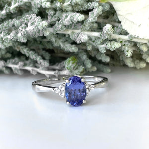 Silver Oval Cut Tanzanite with Trilogy Silver Topaz Highlight Ring