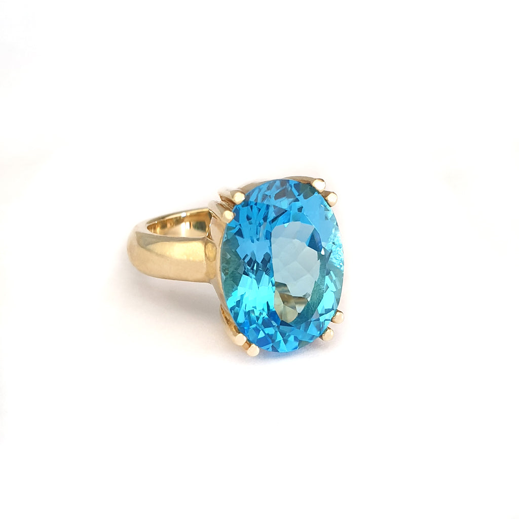 Solid Solitaire Deep Blue Topaz Oval Cut Double Claw Ring