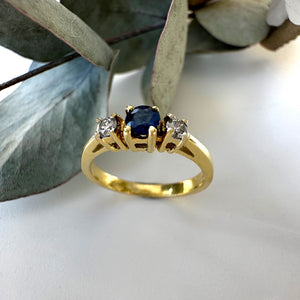 Trilogy Center Sapphire Ring with White Diamond Accents