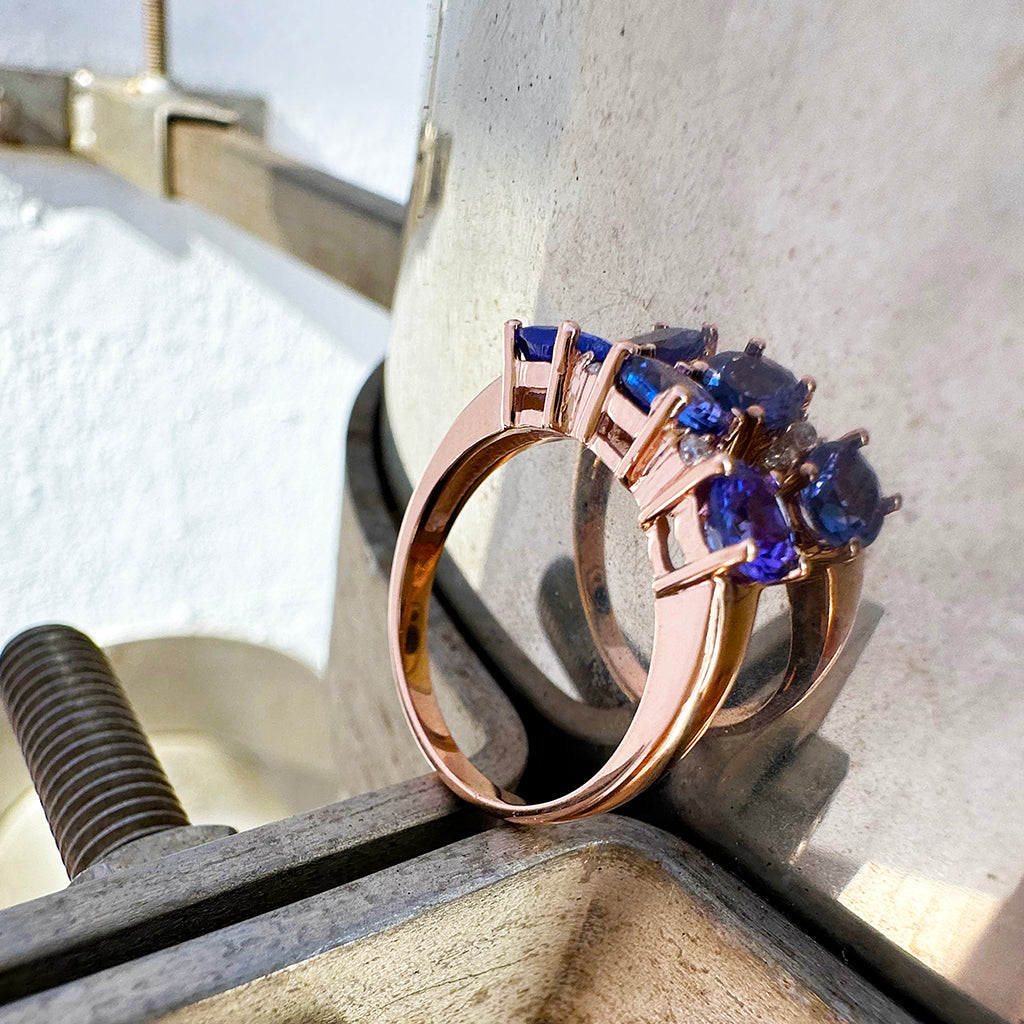 Trilogy Tanzanite Ring with Double Diamond Highlights in Rose Gold