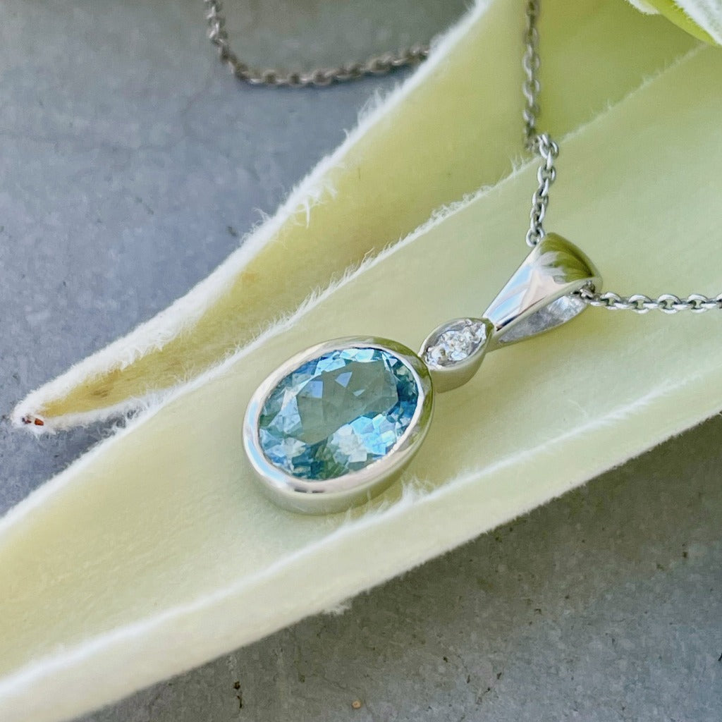 Charming Oval Bezel Set Aquamarine and Diamond Pendant