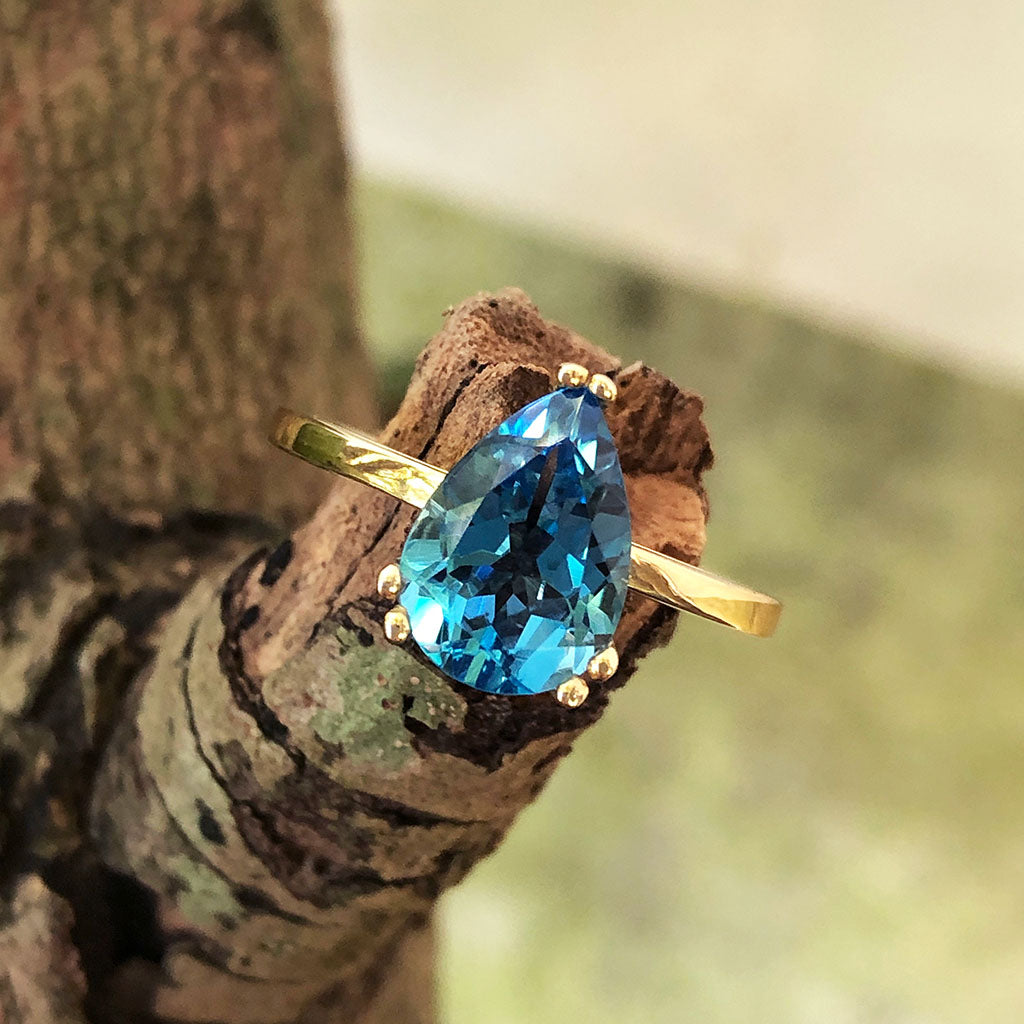 Elegant Solitaire Pear Cut London Blue Topaz Yellow Gold Ring - Main Image