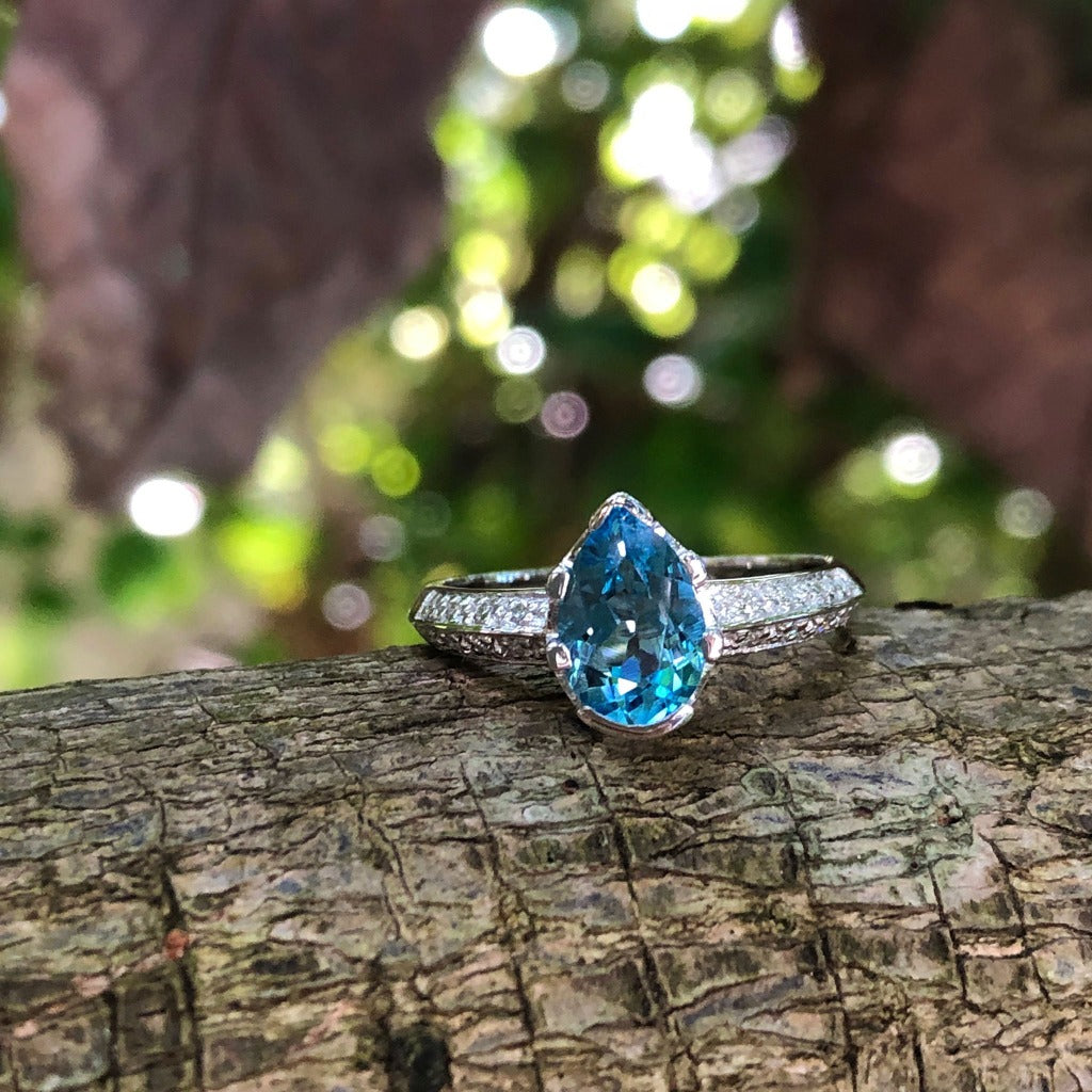 Pear Cut Blue Topaz White Gold Ring with Diamond Band Accent