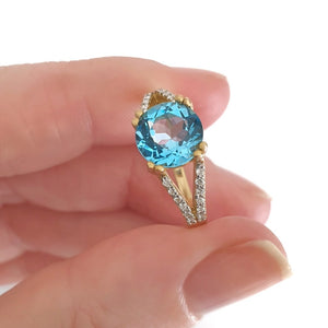 Majestic Round Cut Blue Topaz and Diamond Split Shank Ring