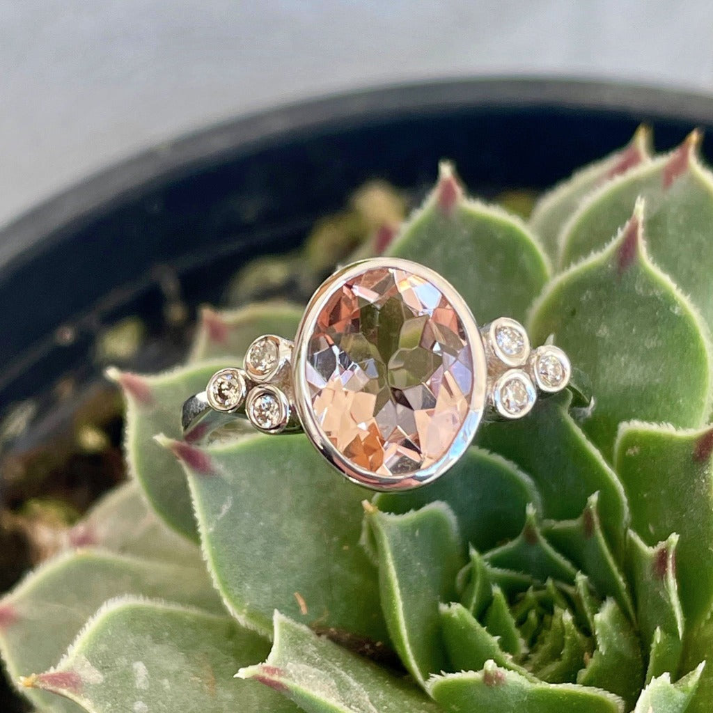 Oval Bezel Set Morganite Ring with Double Diamond Shoulder Trilogy