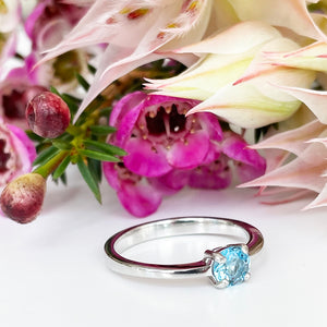 Silver Four Claw Solitaire Blue Topaz Round Cut Ring