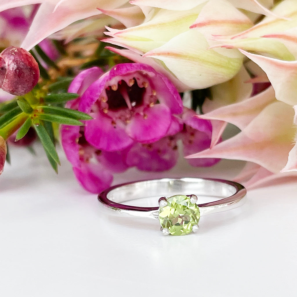 Silver Four Claw Solitaire Peridot Round Cut Ring