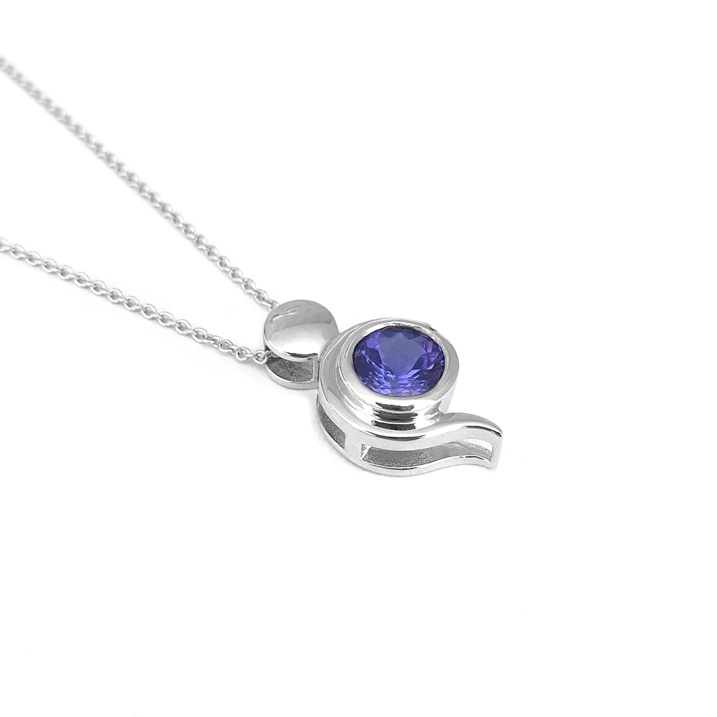 Tanzanite Pendant With White Gold Bead and Curve Detail