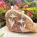 Bird of paradise white gold drop earrings