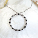 Black and white diamond halo pendant