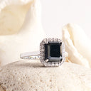 Captivating Emerald Cut Black Diamond With White Diamond Halo White Gold Ring