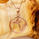 Circular Rose Gold Bird of Prey Strelitzia Pendant