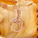 Circular Rose Gold Bird of Prey Strelitzia Pendant