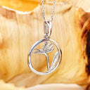 Circular White Bird of Prey Strelitzia Pendant
