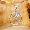 Circular White Bird of Prey Strelitzia Pendant