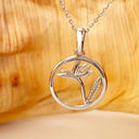 Circular White Bird of Prey Strelitzia Pendant