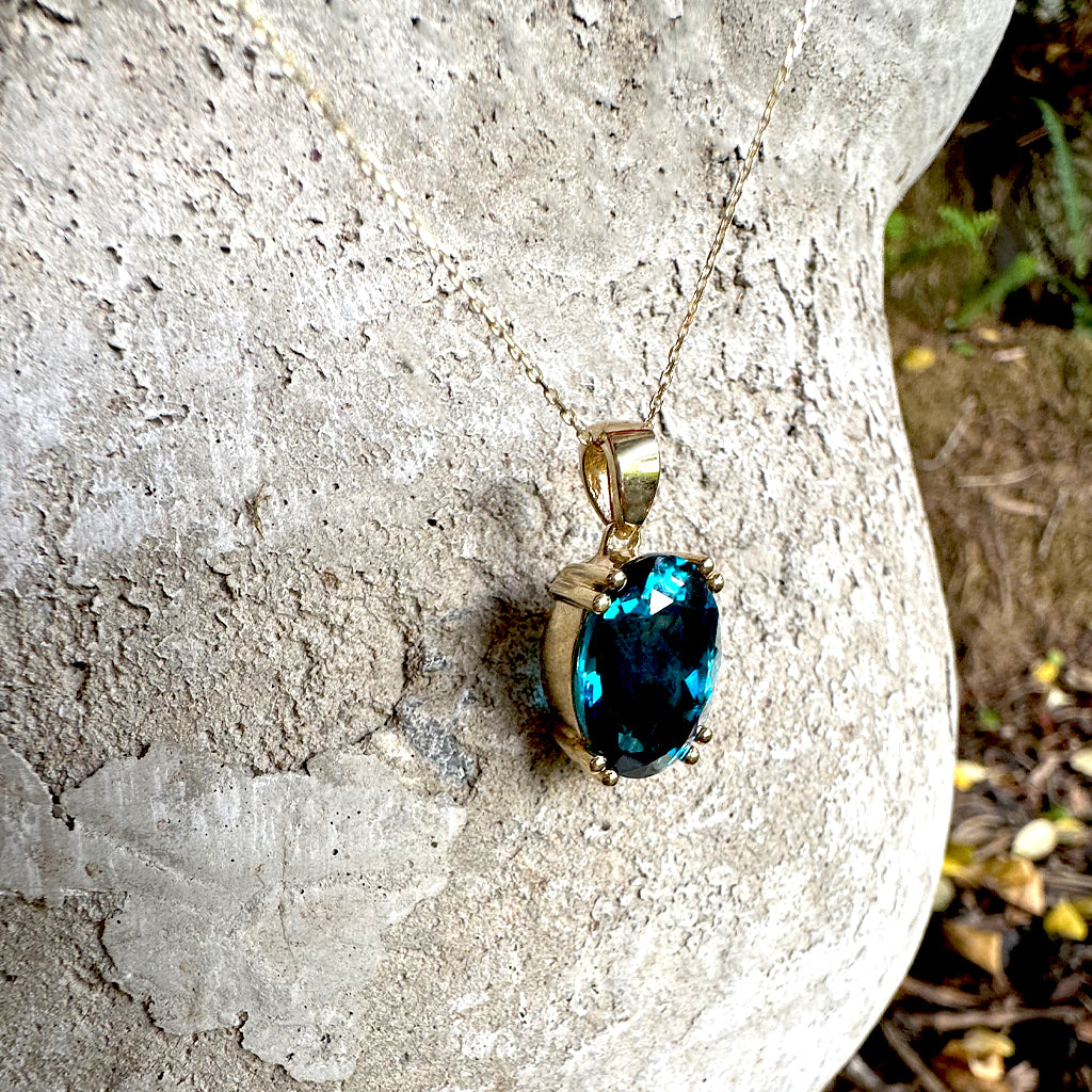 Classic Oval Cut Double Claw London Blue Topaz Yellow Gold Pendant