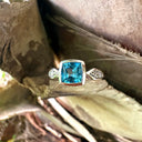 Contemporary Square Cushion Cut Blue Topaz With Diamond Shoulder Detail Ring