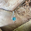 Curvaceous Blue Topaz and Diamond Pendant
