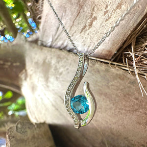 Curvaceous Blue Topaz and Diamond Pendant