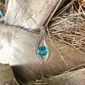 Curvaceous Blue Topaz and Diamond Pendant