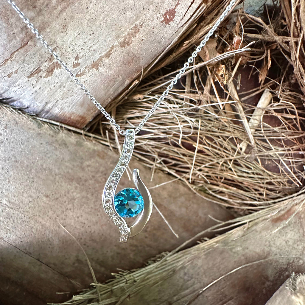 Curvaceous Blue Topaz and Diamond Pendant