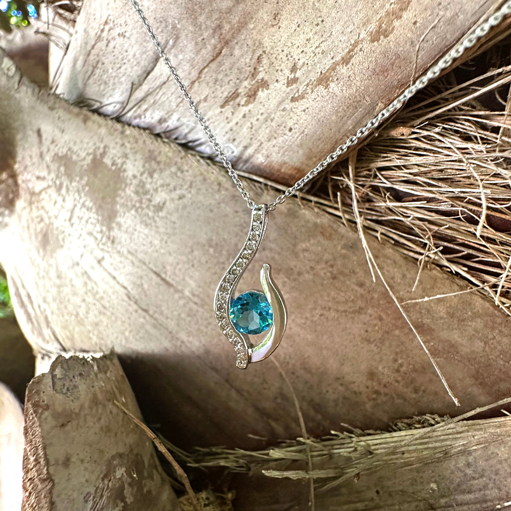 Curvaceous Blue Topaz and Diamond Pendant