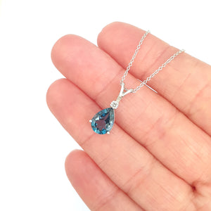 Delightful Handcrafted Split Bale Pear Drop Blue Topaz Pendant with Diamond Highlight