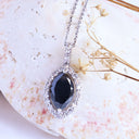 Decadent Marquise Cut Black Diamond With White Diamond Halo White Gold Pendant