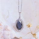 Decadent Marquise Cut Black Diamond With White Diamond Halo White Gold Pendant