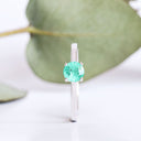 Delicate Solitaire Emerald Four Claw White Gold Ring