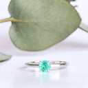 Delicate Solitaire Emerald Four Claw White Gold Ring