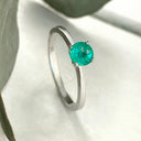 Delicate Solitaire Emerald Four Claw White Gold Ring
