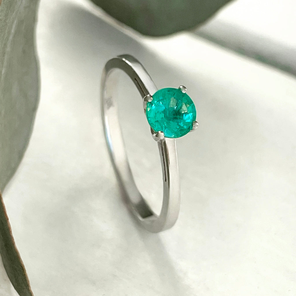 Delicate Solitaire Emerald Four Claw White Gold Ring