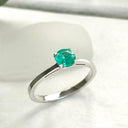 Delicate Solitaire Emerald Four Claw White Gold Ring
