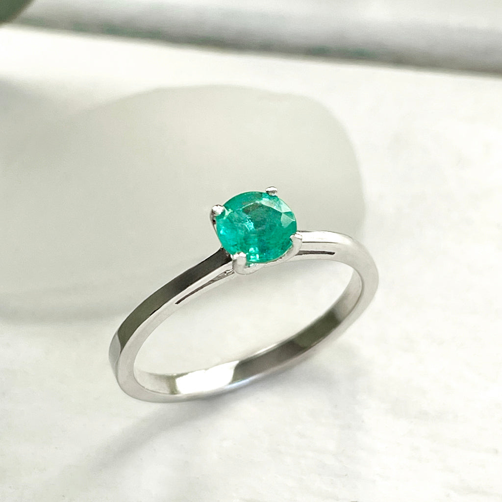 Delicate Solitaire Emerald Four Claw White Gold Ring