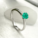 Delicate Solitaire Emerald Four Claw White Gold Ring
