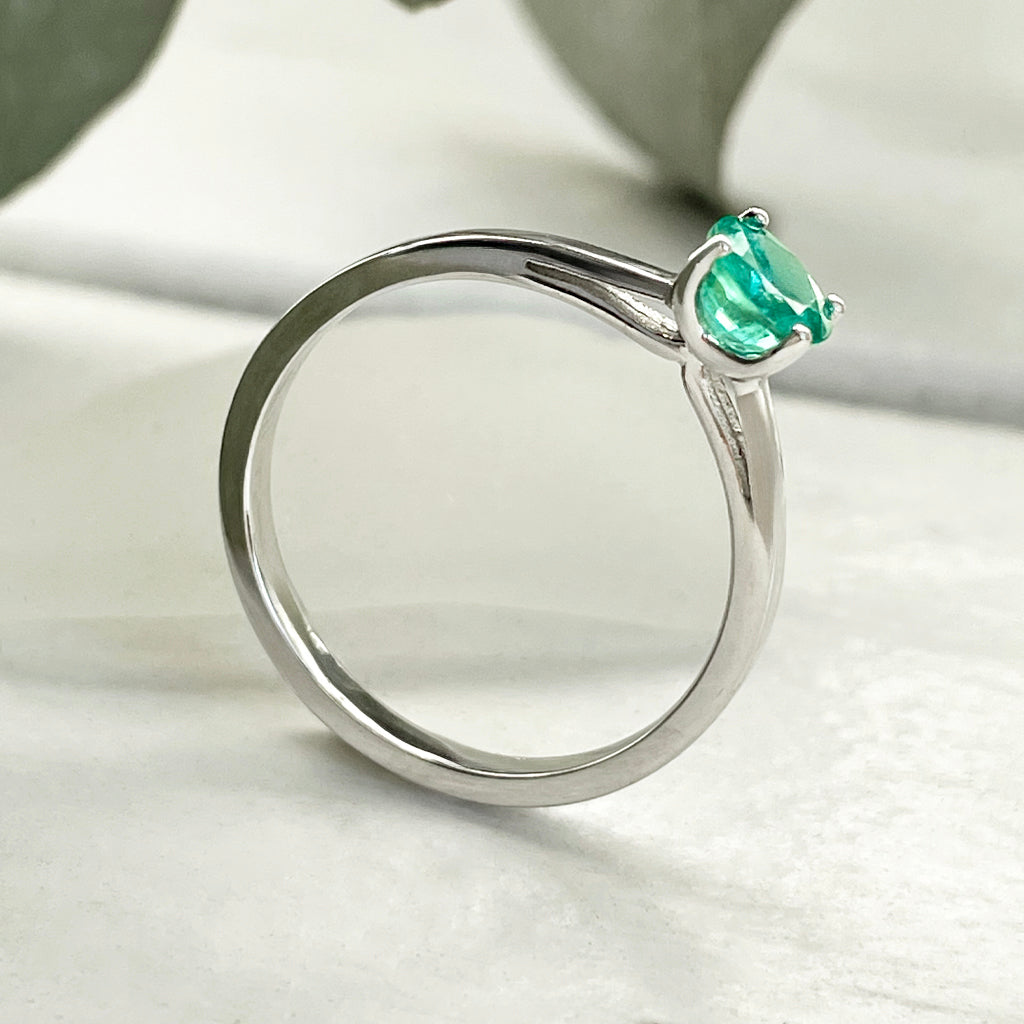Delicate Solitaire Emerald Four Claw White Gold Ring