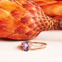 Delicate Triple Diamond And Rose Gold Band Oval Cut Tanzanite Ring