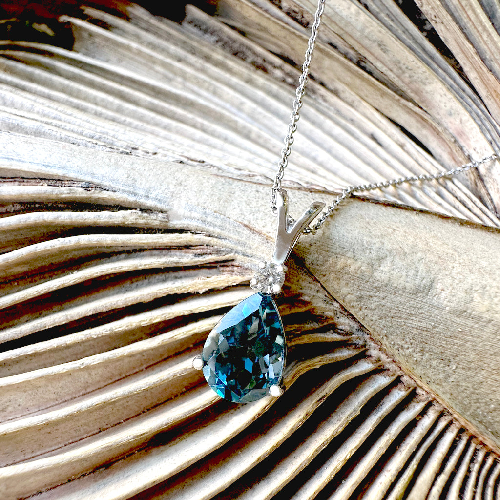Delightful Handcrafted Split Bale Pear Drop Blue Topaz Pendant with Diamond Highlight