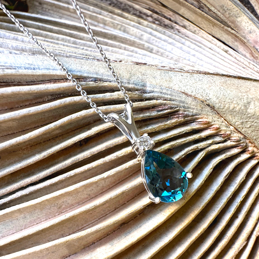 Delightful Handcrafted Split Bale Pear Drop Blue Topaz Pendant with Diamond Highlight