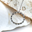 Black and white diamond halo pendant