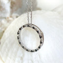 Black and white diamond halo pendant