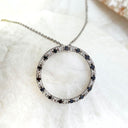 Black and white diamond halo pendant